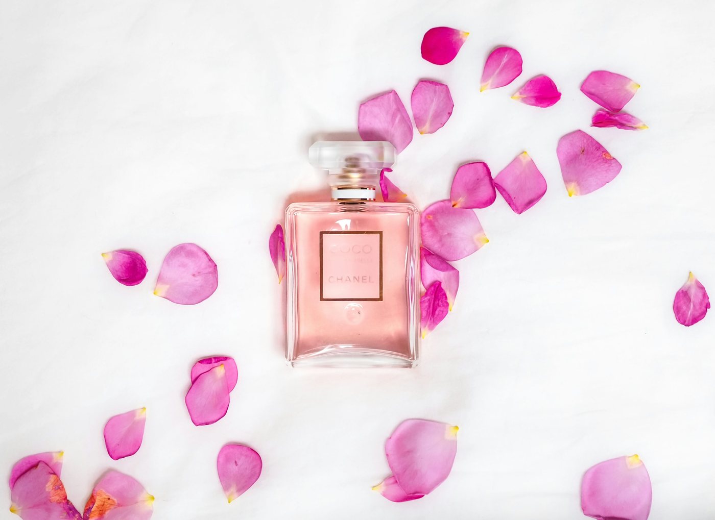 Illustrative perfume bottle with floral accents